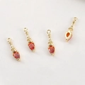 Detailed view of four vintage gold plated pendants with teardrop red zircon stones - 14k Gold Red Zircon Small Lamp Style