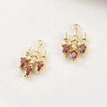 Macro shot of gold-plated chandelier pendants with red pear-cut zircon for DIY jewelry - 14k Gold Red Zircon Chandelier Style