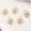 Detailed macro view of vintage gold plated chandelier pendants with cubic zirconia crystals - 14k Gold White Zircon Chandelier Style
