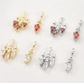 Macro detail of vintage chandelier charms with cubic zirconia for DIY jewelry - White Gold White Zircon Chandelier Style