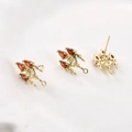 Macro detail of 14k gold plated earring studs with three red pear-cut zircon stones - 14k Gold Red Zirconia Crystal Light (19.5x11.5mm)