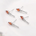 Macro view of 14k gold plated earring studs with orange pear-cut zircon for DIY jewelry - White Gold Red Zirconia (19.7x4.5mm)