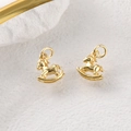 Detailed macro view of a pair of golden rocking horse charms for DIY jewelry making - 18k Gold Rocking Horse (Approx 12*10mm)