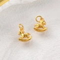 Macro detail of two matte gold rocking horse pendants with fine sand finish texture - 24k Sand Gold Rocking Horse (Approx 12*10mm)
