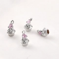 Macro detail of cupcake pendant with pink heart gemstone and 14k gold plated finish - White K Pink Zircon Heart Cake