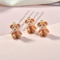 Detailed view of three mini plush flocked brown bears with pink bows for DIY jewelry - 13# Bear / Orange Red