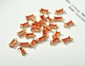 Detailed macro view of 18k gold plated rectangular orange crystal pendants for DIY jewelry - Tomato Red Rectangle (8.5*4mm)