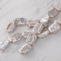Detail of natural iridescent baroque rectangular freshwater pearls for DIY jewelry making - Iridescent White Rectangular Bead String / 1 Strand (Approx 16 Pieces)