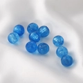 Close-up of translucent blue glass round beads on white silk fabric for DIY jewelry - Round Beads / 5 Pieces / Lake Blue