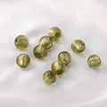 Macro shot of 9 olive green translucent glass beads on white satin for jewelry making - Round Beads / 5 Pieces / 13# Olive Green