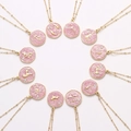 Set van 12 goudkleurige dierenriem kettingen met roze glitter en kristallen hanger - Stier (Goud + Roze)