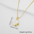 Macro view of gold butterfly pendant with white enamel wings and zircon stones details - Butterfly Style (Style 5)