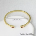 Detail of gold brass open bangle with red crystal and micro-pave cubic zirconia accents - Red Gemstone Style (Style A)