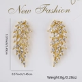Detailed view of angel wing earrings with colorful zircon inlay and dimensions 3.49x1.45cm - White