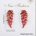 Sparkling ruby red zircon angel wing earrings for women, featuring a vibrant 3.49cm tassel - Purple