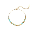 Détail du bracelet avec perles en métal doré et pierres cylindriques bleu ciel - Style de pierre cylindrique azur (B2160-B)