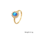 Bague vintage plaquée or 24 carats avec pierre ovale bleue et entourage zircon - Style Diana Pierre Bleue Dorée (R751-GO-B)