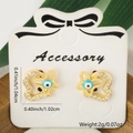 Detailed view of gold heart stud earrings with blue evil eye and sparkling zircon stones - Hollow Heart Blue Eye Style (Style 2)