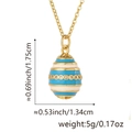 Detailed view of striped enamel egg pendant with dimensions of 1.75cm by 1.34cm - Pendant Only (Without Chain) / Blue