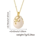 Detail view of Faberge style egg pendant with gold scrollwork and rhinestones - Pendant Only (Without Chain) / Style A (White)