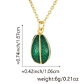 Detailed view of green enamel egg pendant with gold lattice texture and dimensions - Pendant with Chain / Dark Green (Style F)