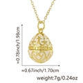 Russian-style egg pendant necklace in cream enamel with golden floral hollow pattern - White