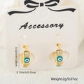 Detail shot of Evil Eye earrings with blue enamel, cubic zirconia, and dimensions info - Blue Style