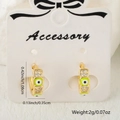 Gold huggie earrings with green evil eye enamel and micro-set cubic zirconia stones - Green Style