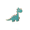 Detailed close-up of a cute green dinosaur enamel brooch with gold trim and pin backing - Teal Dinosaur With Red Fin (CL53)