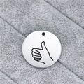 Macro detail of round stainless steel pendant with engraved thumbs-up hand gesture sign - Thumbs Up Gesture (AL334)