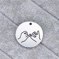 Macro detail of round stainless steel pendant with engraved pinky promise gesture art - Pinky Swear Gesture (AL340)