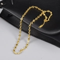 18K gold plated oval pig nose link chain necklace with lobster clasp on leather background - Mariner/Coffee Bean Link Chain (L200) - Gold