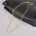 Zweilagige Edelstahl-Halskette in Gold mit Schlangenkette und Kugelketten-Detail - 18K-Gold