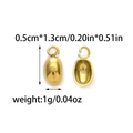 Macro shot of gold bean-shaped stainless steel pendants for DIY necklace jewelry crafting - Gold Bean Shape Style (TZ-TP1330-02)