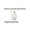 Macro shot of 18K gold plated teardrop pearl pendant measuring 0.9cm by 2.3cm - Teardrop Pearl Pendant