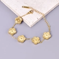 18K gold plated titanium steel bracelet featuring five ribbed flower charms on a fine chain - 18K Gold