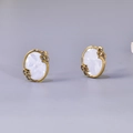 Oval 18K gold earrings with white shell inlay and brown gemstone accents in a leaf pattern - Stud Earrings / Gold