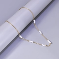 Elegant gold stainless steel necklace featuring minimalist triple pearl groups on fine chain - 18K Gold