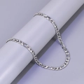 Detailed view of silver stainless steel Figaro chain links on a cylindrical display stand - Figaro Chain / Silver