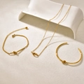 Three-piece golden stainless steel jewelry set with knot pendant necklace, bracelet and bangle - Combination Style (Necklace Bangle Bracelet)