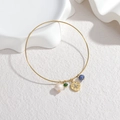 Gold open bangle with pearl, green crystal, coin charm and blue marble bead charm - Green and Blue Bead Coin Style (OLBB1227-lvlan)