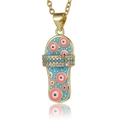 Detailed close-up of flip-flop pendant with evil eye pattern and blue enamel finish - Blue