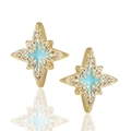 Macro shot of gold North Star earrings with light blue enamel and sparkling micro zircons - Blue