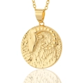 Detailed macro view of an 18K gold plated Aries zodiac pendant necklace with relief design - Capricorn
