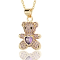 Macro detail of golden bear pendant featuring purple heart stone and pavé setting - Full Zircon Purple Bear (D442-5)