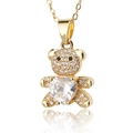 Macro shot of gold bear pendant with cubic zirconia heart and clear white crystals - White Zircon Heart Bear (D438-3)