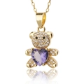 Close-up of golden bear necklace with purple heart gemstone and white zircon pavé - Purple Heart Bear (D438-5)