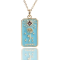 Detail of tarot-style lovers pendant with blue enamel, gold rose and purple zircon - Blue