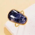 Vintage gold ring featuring irregular blue natural stone with a hammered finish - Kyanite