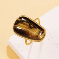 Anillo vintage de acero inoxidable con piedra ojo de tigre y banda dorada trenzada - Ojo de tigre